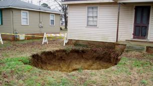 sinkhole in a yard